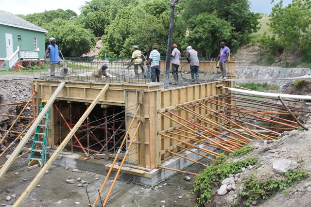 Workmen in concrete operations on the new Bath Village Bridge on June 16, 2017